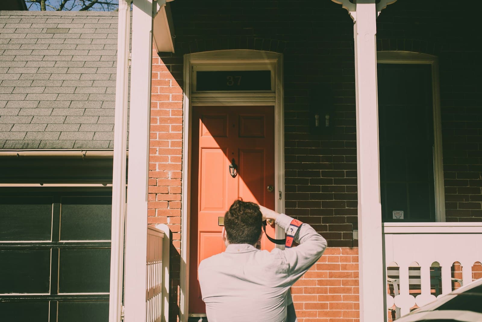 Inspector photographing a porch